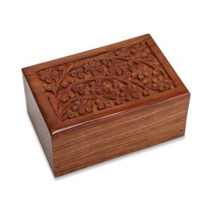Carved wooden box on white background.