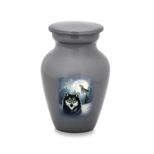Decorative urn with wolf design on white background.