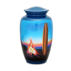 Decorative urn with beach sunset and surfboard design.