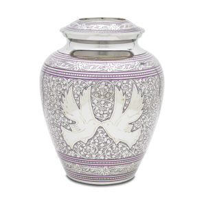 Decorative purple floral ceramic urn on white background.