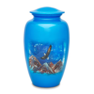 Blue urn with eagle and mountain design.