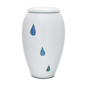 White vase with iridescent raindrop designs.