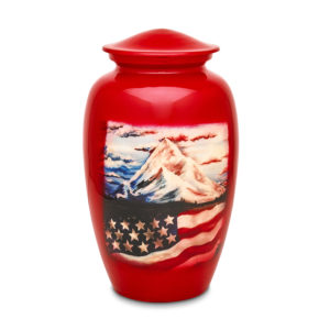Red urn with patriotic American flag and mountain scene.