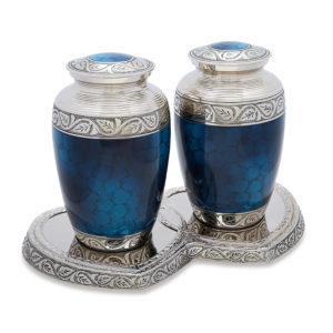 Blue and silver decorative urns on tray.