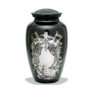 Decorative urn with angel and cross imagery.