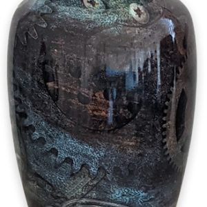 Decorative ceramic vase with blue glaze and embossed design.