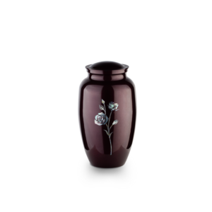 Decorative urn with silver rose design on white background.