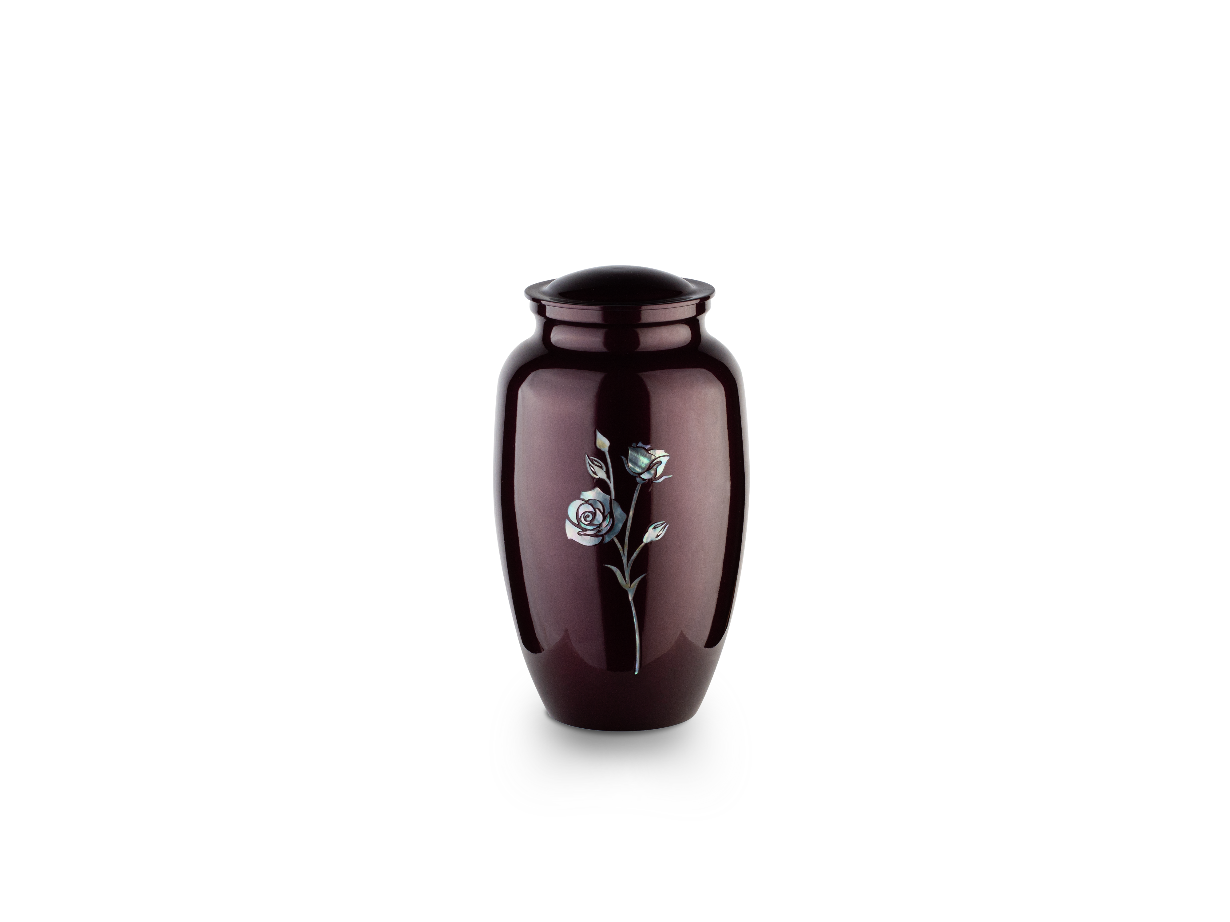 Decorative urn with silver rose design on white background.