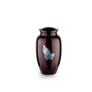 Elegant maroon vase with iridescent fish design, isolated.