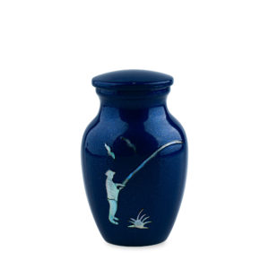 Blue vase with white golfing silhouette design.