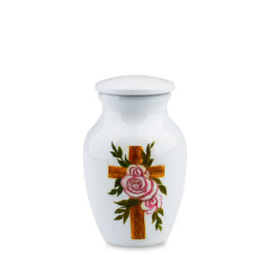 Decorative urn with floral cross design on white background.