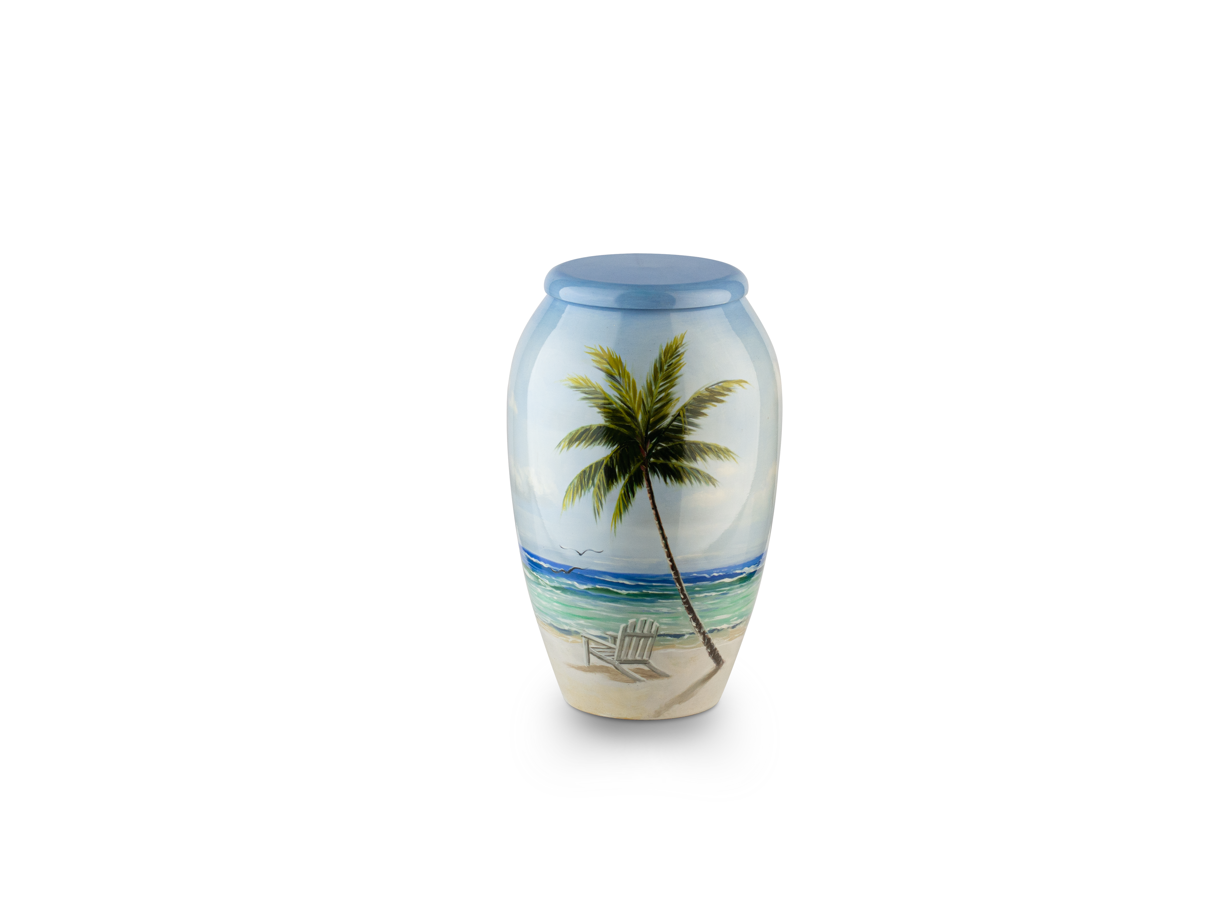 Tropical beach scene painted on decorative vase.