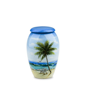 Beach scene painted urn on white background.
