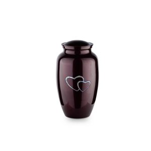 Dark urn with silver heart design on white background.