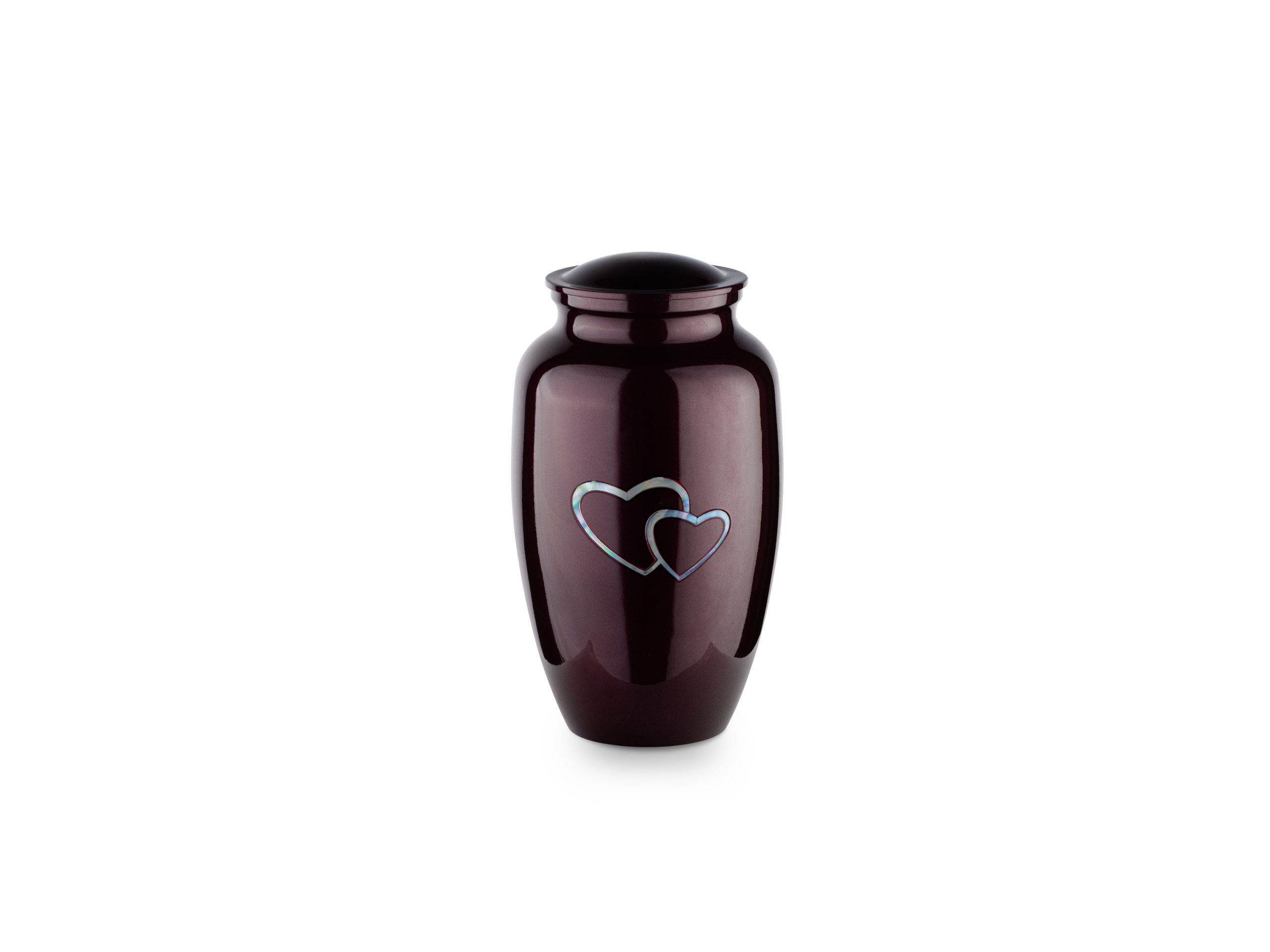 Dark urn with silver heart design on white background.