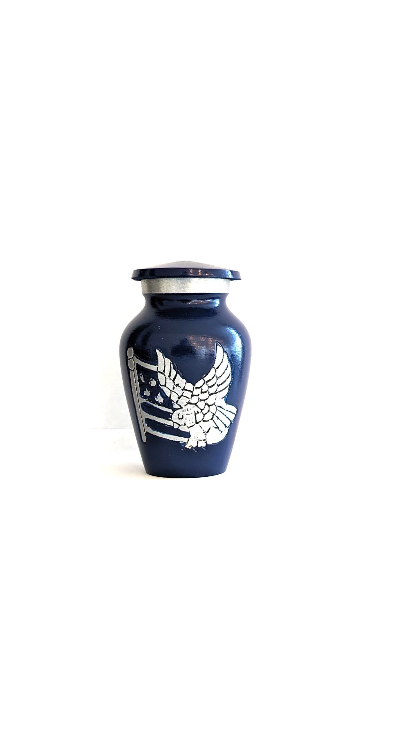 Blue vase with white eagle design.